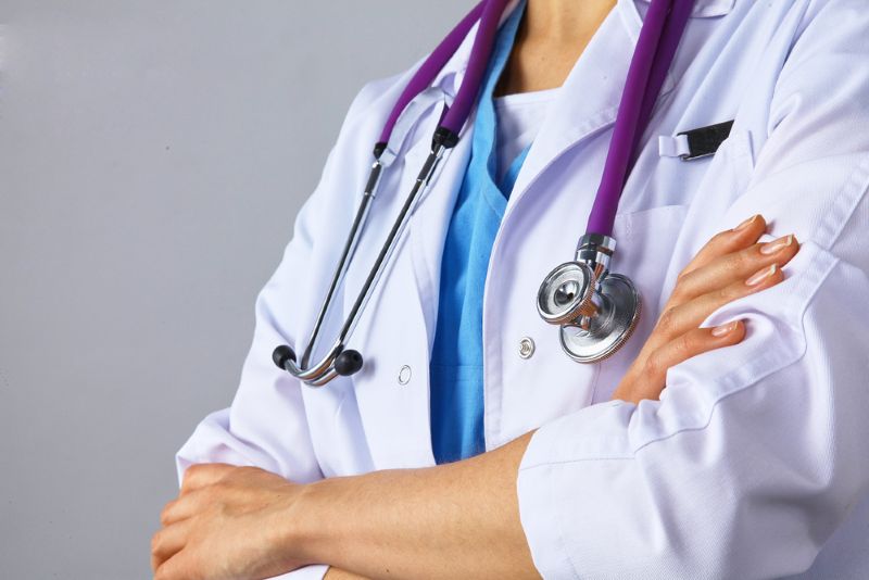 Doctor standing with arms crossed