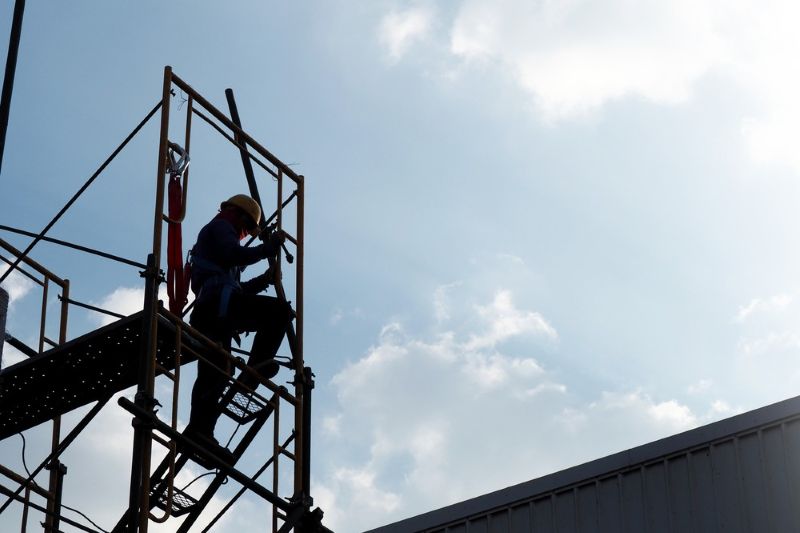 Construction worker standing on scaffolding