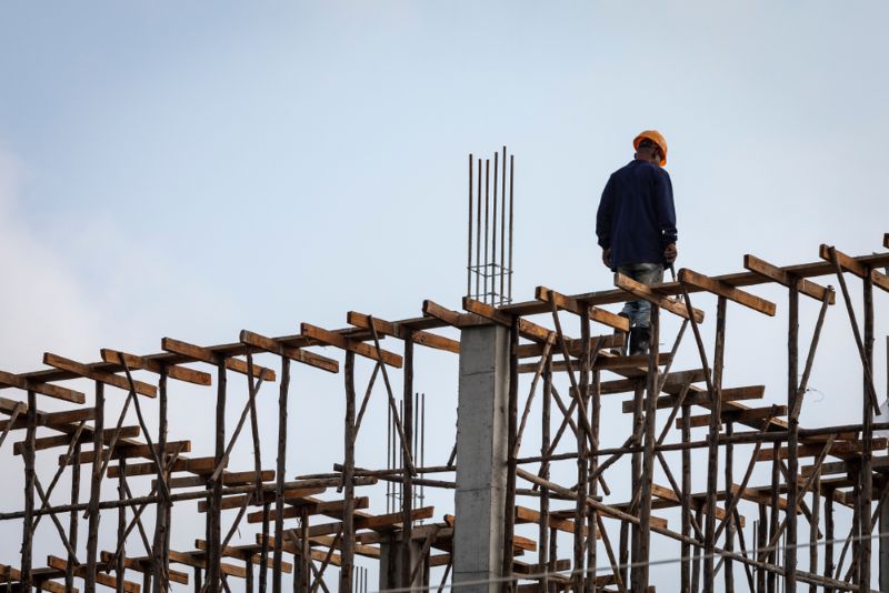 Construction worker walking along the construction site