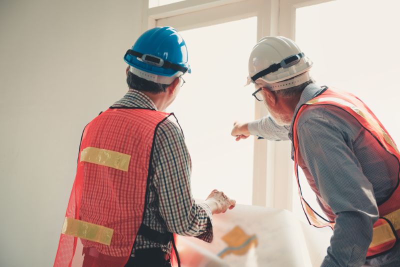 Two construction workers on the work site