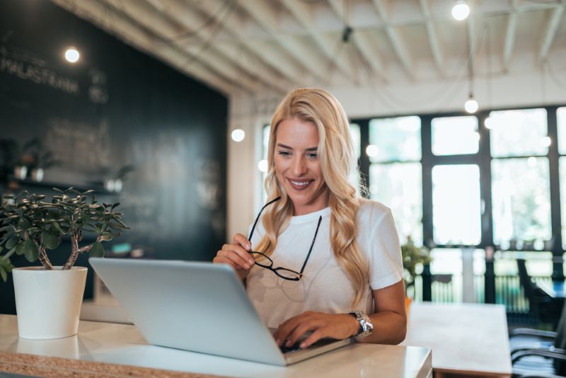 Blonde woman working in a public coworking space