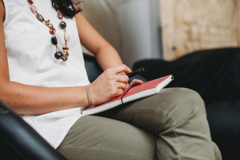 Therapist holding a notepad and pen