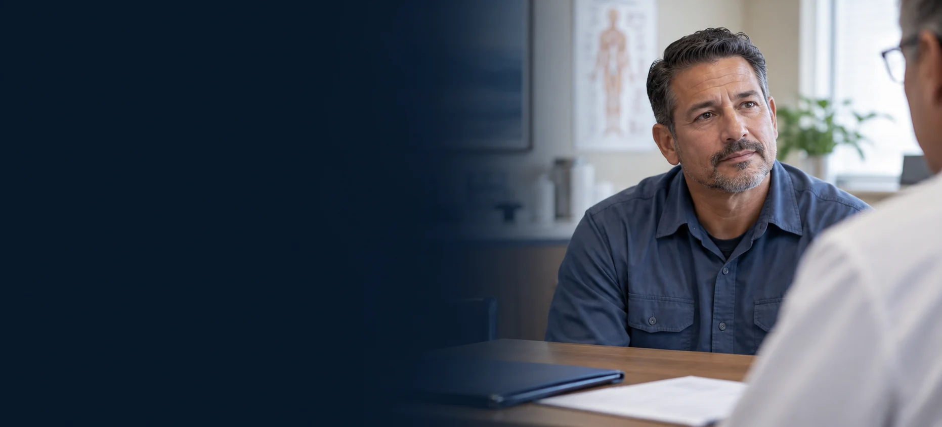 Worker discussing his condition during a medical consultation