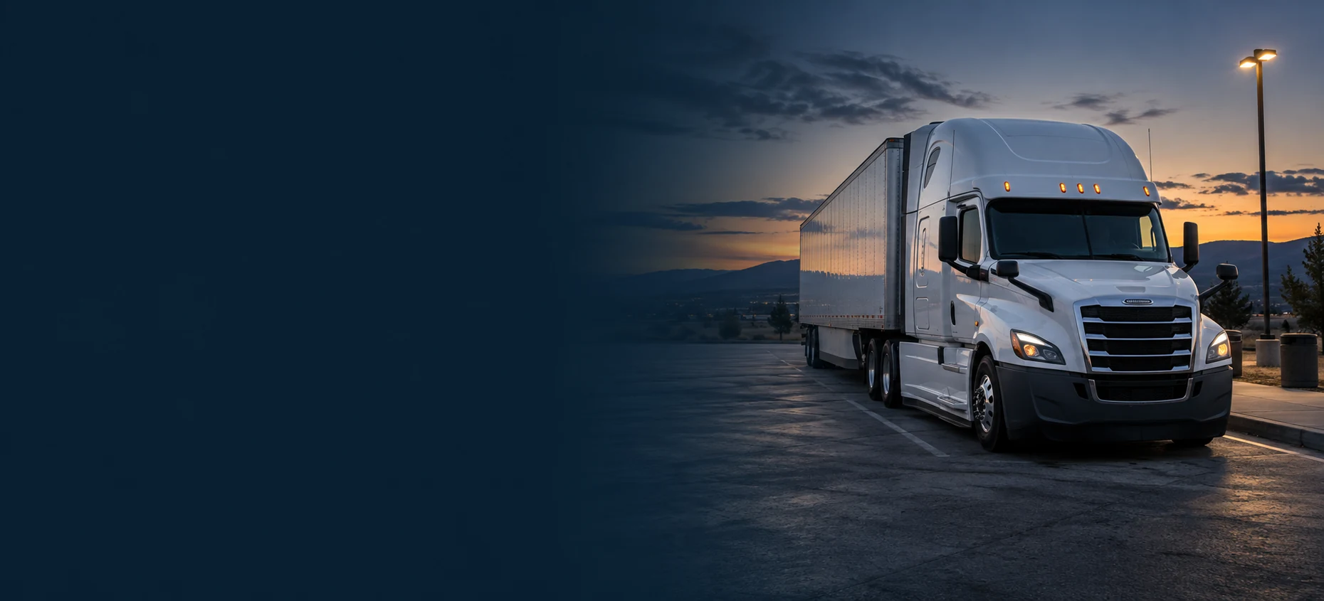 Commercial truck parked at a California highway rest area at dusk